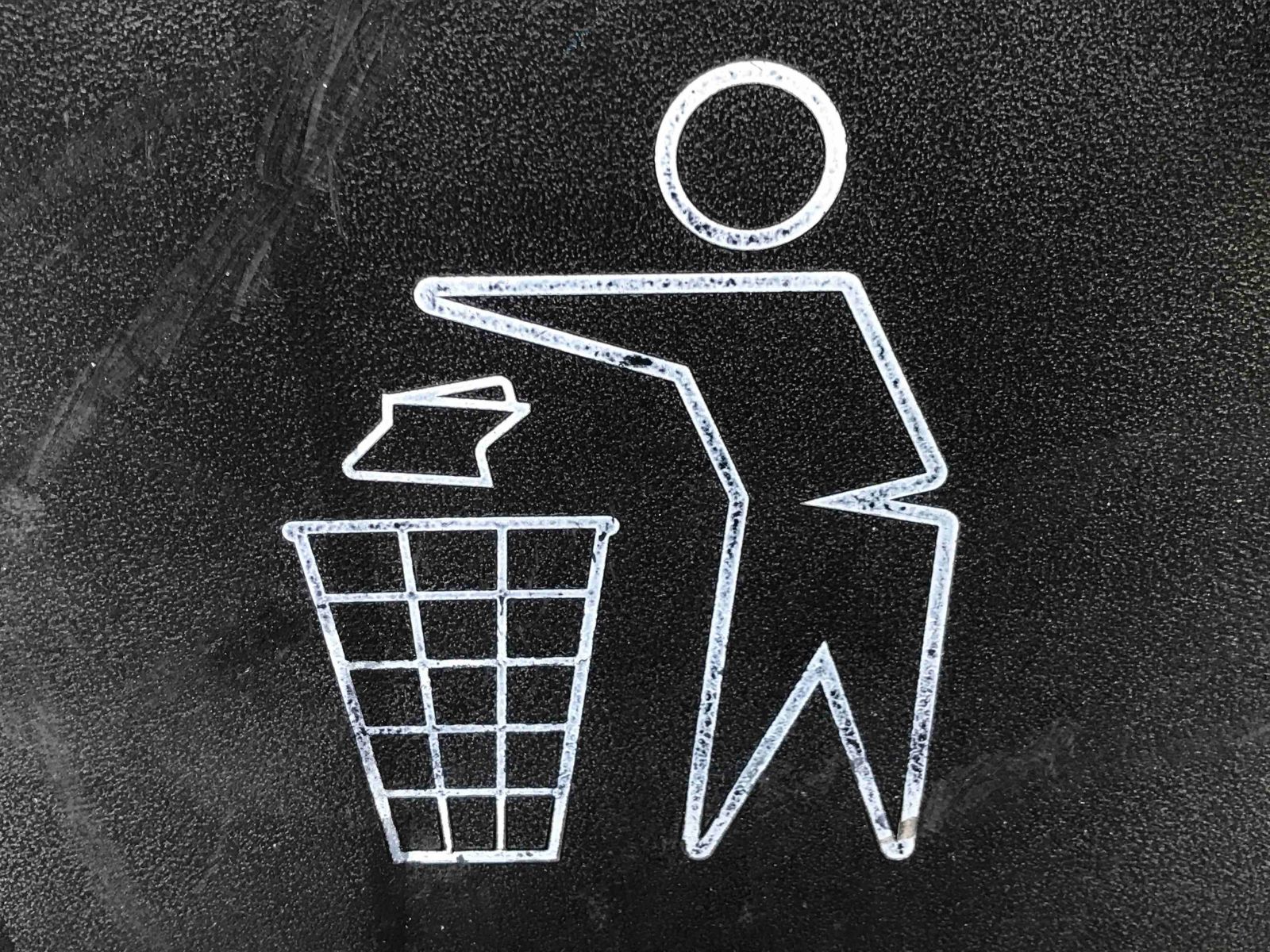 A stick figure waste logo